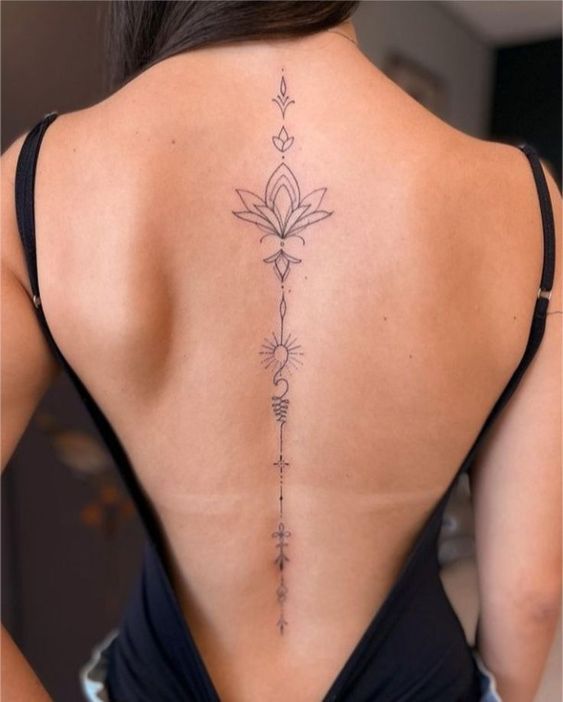 Spiritual Symbols tattoo, spine tattoos, spine tattoo designs, Spiritual Symbol tattoo ideas