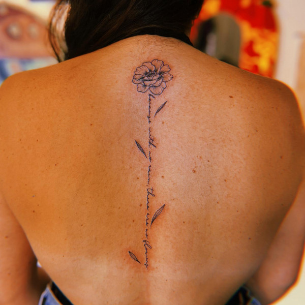 Flower and Script Spine Tattoo : Beauty in Bloom