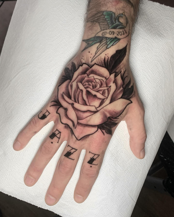 25 Timeless Rose Hand Tattoos : Bold Tribute Rose and Script Hand Tattoo