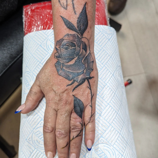 25 Timeless Rose Hand Tattoos : Blue-Shaded Rose Hand Tattoo