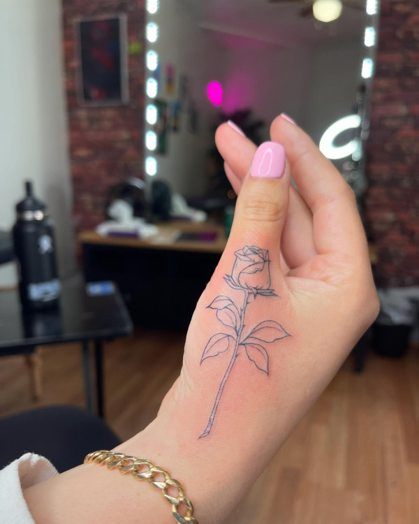 25 Timeless Rose Hand Tattoos : Fine Line Rose Thumb Tattoo