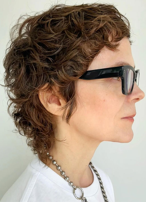 Curly Brunette Choppy Pixie, low-maintenance choppy pixie haircut for women over 50