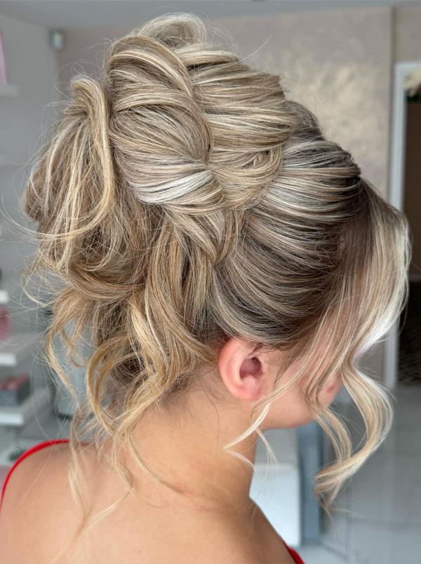 Elegant Twisted Blonde Updo with Loose Curls, 90s inspired updo, Pamera Anderson inspired updo, piled updos, trending piled updo hairstyle, trendsetting updo hairstyle