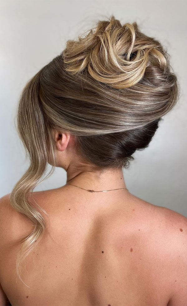 Modern French Twist , 90s inspired updo, Pamera Anderson inspired updo, piled updos, trending piled updo hairstyle, trendsetting updo hairstyle