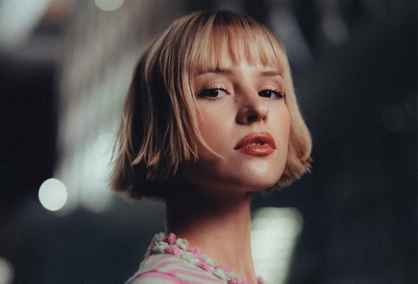 27 French Hairstyles for a Chic Makeover: Blunt Bob with Micro Bangs