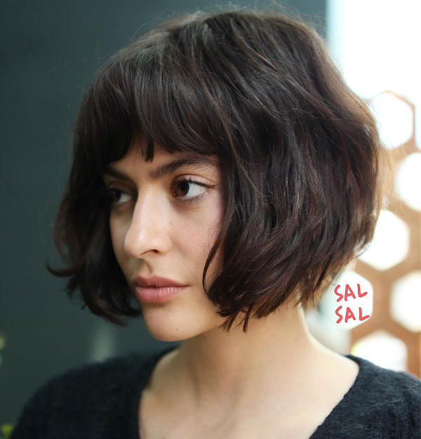 27 French Hairstyles for a Chic Makeover: Textured Bob with Wispy Fringe