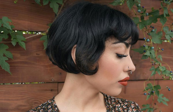 27 French Hairstyles for a Chic Makeover: Vintage Curled Bob with Rounded Bangs