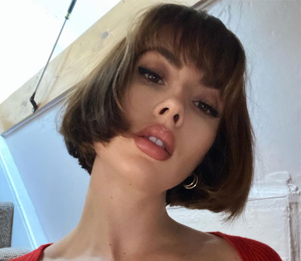 27 French Hairstyles for a Chic Makeover: Sleek French Bob with Blunt Bangs