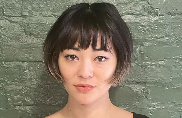 27 French Hairstyles for a Chic Makeover: Edgy Bob with Choppy Bangs and Blunt Ends