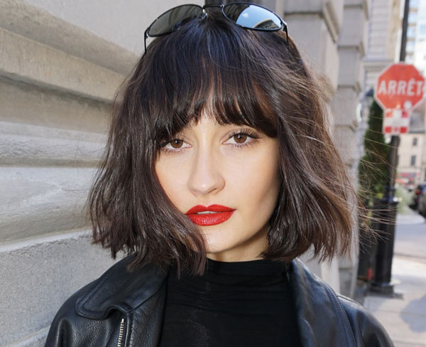 27 French Hairstyles for a Chic Makeover: Chic Tousled Bob with Full Fringe